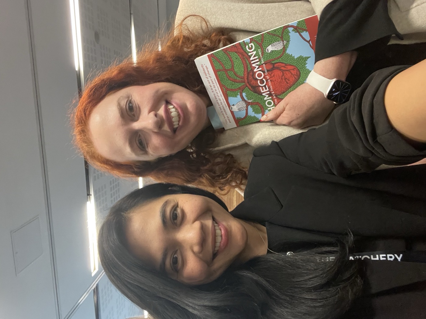 Ratu Nida with a reader holding a copy of Homecoming