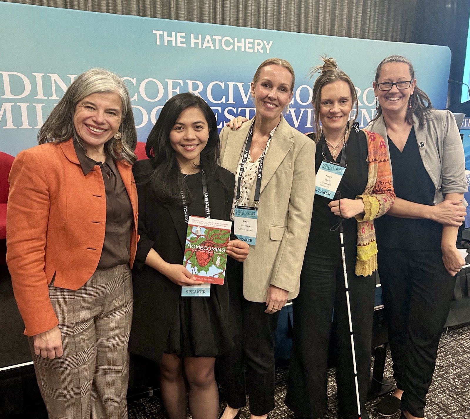 Ratu Nida with fellow speakers at The Hatchery Ending Coercive Control and Domestic Violence Conference, holding Homecoming.